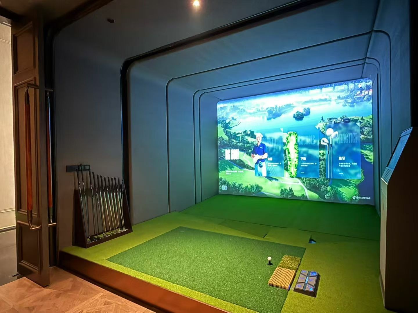 RG small-space custom enclosure with Auto-Tee — padded surround, turf, hitting mat and club rack